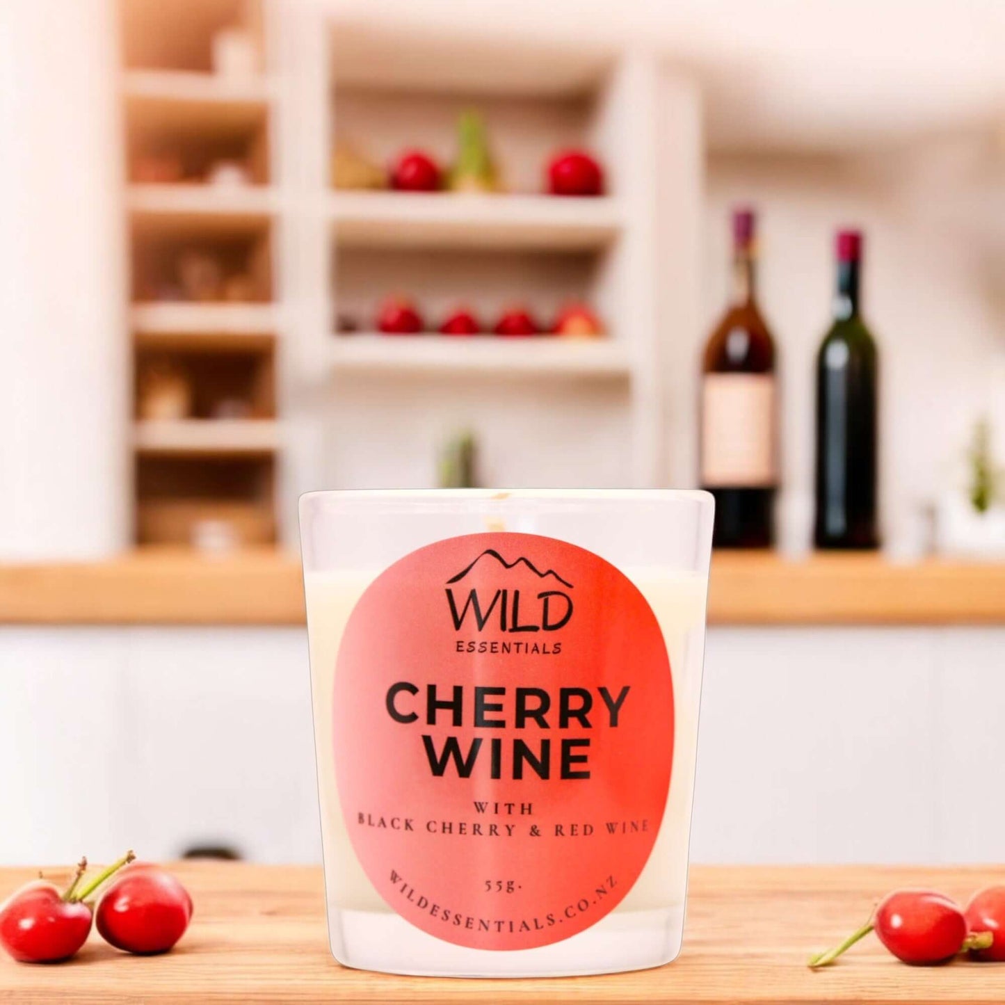 Photograph of the Cherry Wine Mini Candle from Wild Essentials, taken in a modern kitchen.