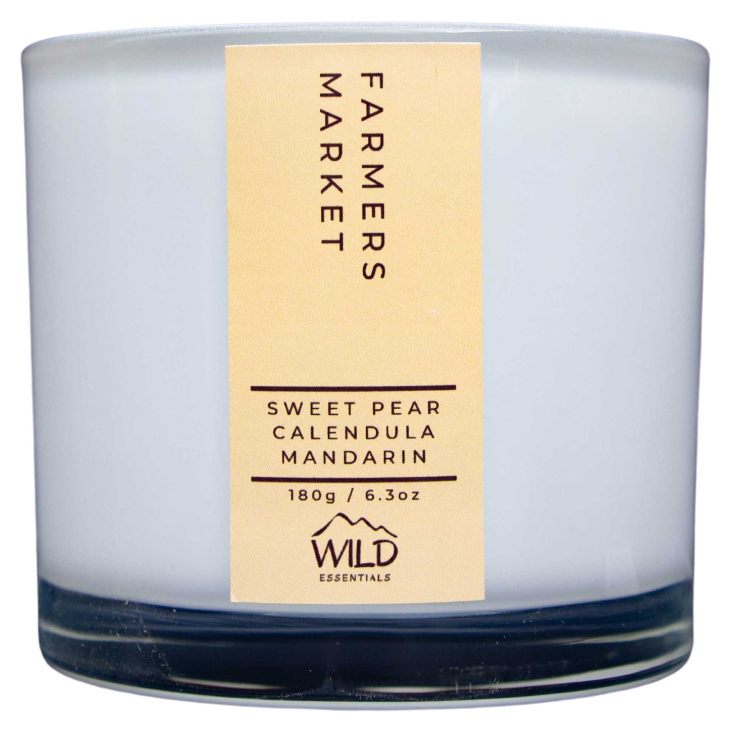 Photograph of the Luxurious Farmers Market Aromatherapy Candle by Wild Essentials with scents of Sweet Pear, Calendula, and Mandarin.