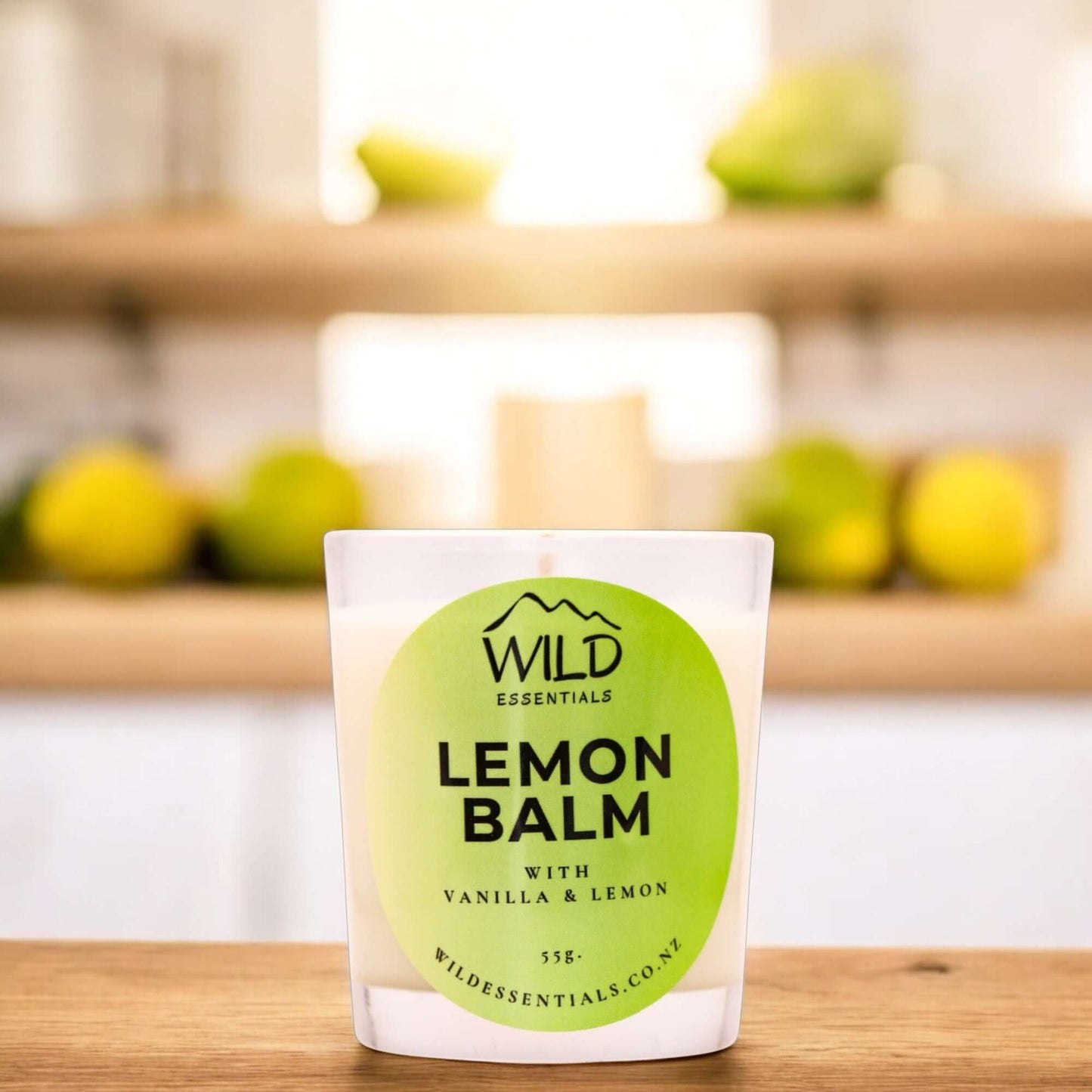 Photograph of the Lemon Balm Mini Candle from Wild Essentials, taken in a modern kitchen.
