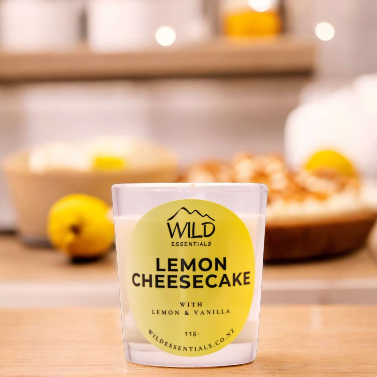Photograph of the Lemon Cheesecake Mini Candle from Wild Essentials, taken in a modern kitchen.