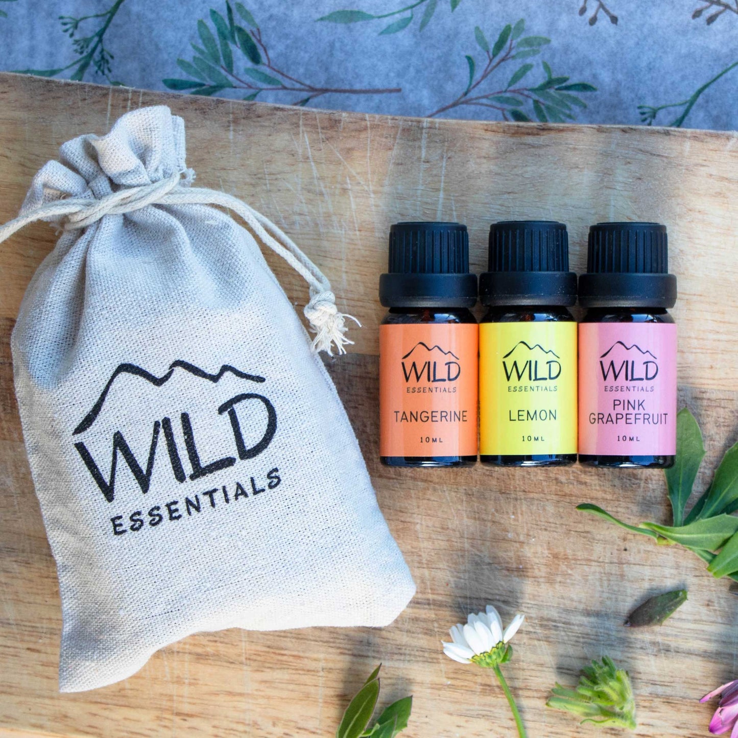 Photo of the Energy Boost Esasential Oil Pack from Wild Essentials which includes three different essential oils, namely Tangerine, Lemon, and Pink Grapefruit.