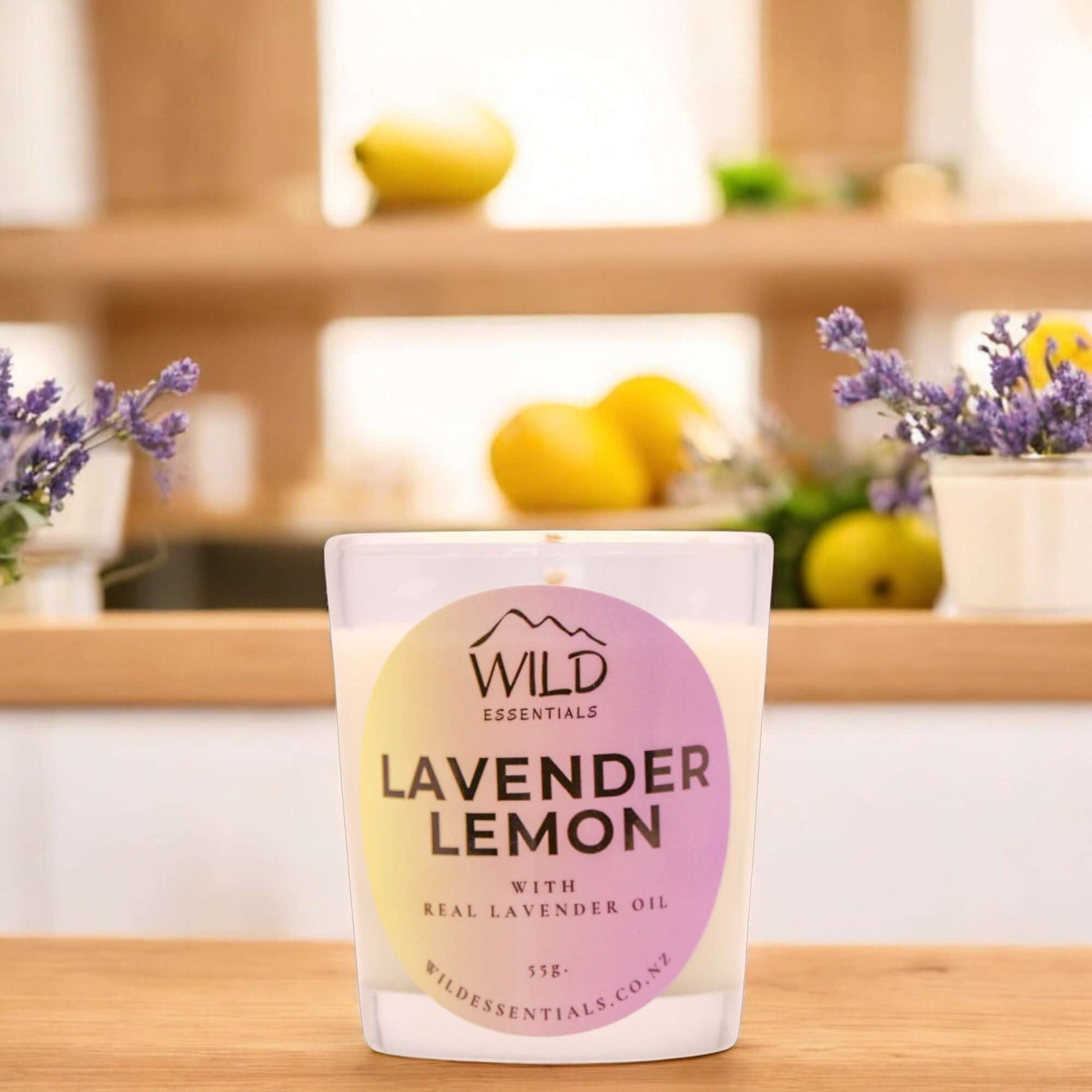 Photograph of the Lavender Lemon Mini Candle from Wild Essentials, taken in a modern kitchen.