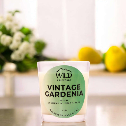 Photograph of the Vintage Gardenia Mini Candle from Wild Essentials, taken in a modern kitchen.